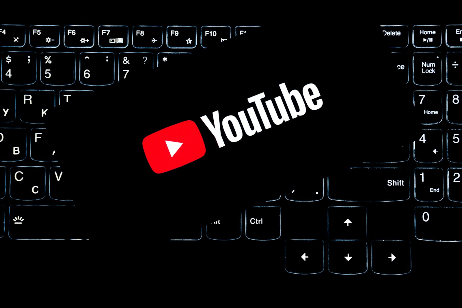 Youtube logo on a backlit keyboard.