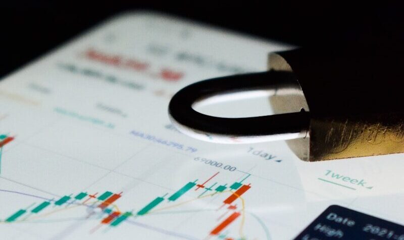 a pen sitting on top of a paper next to a calculator